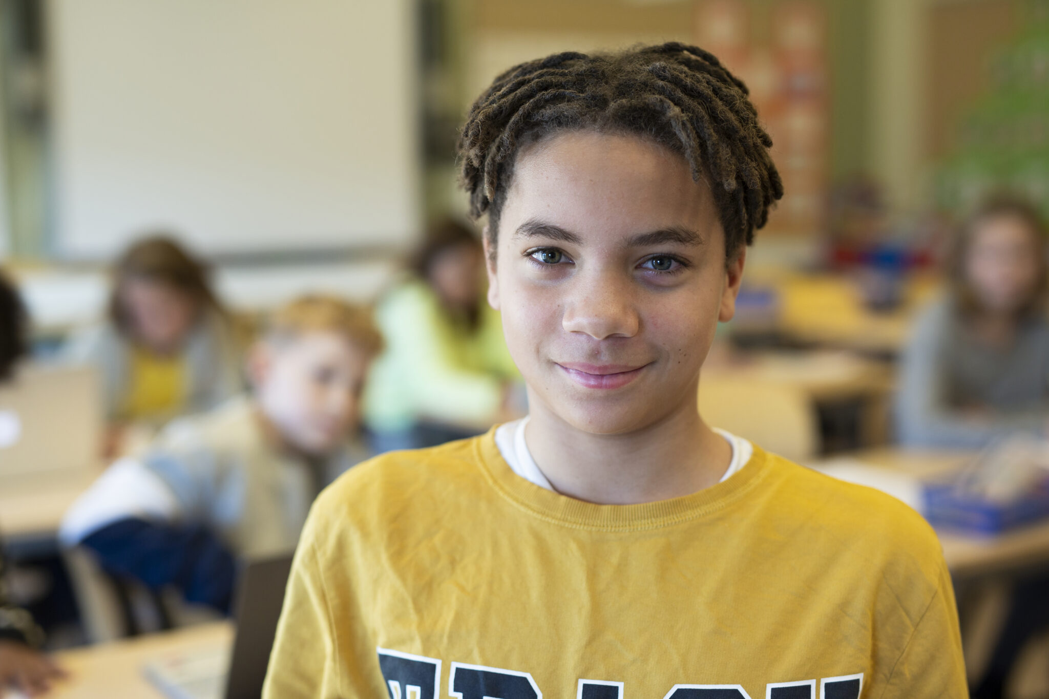 preteen boy in classroom