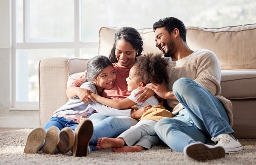 family sitting on floor