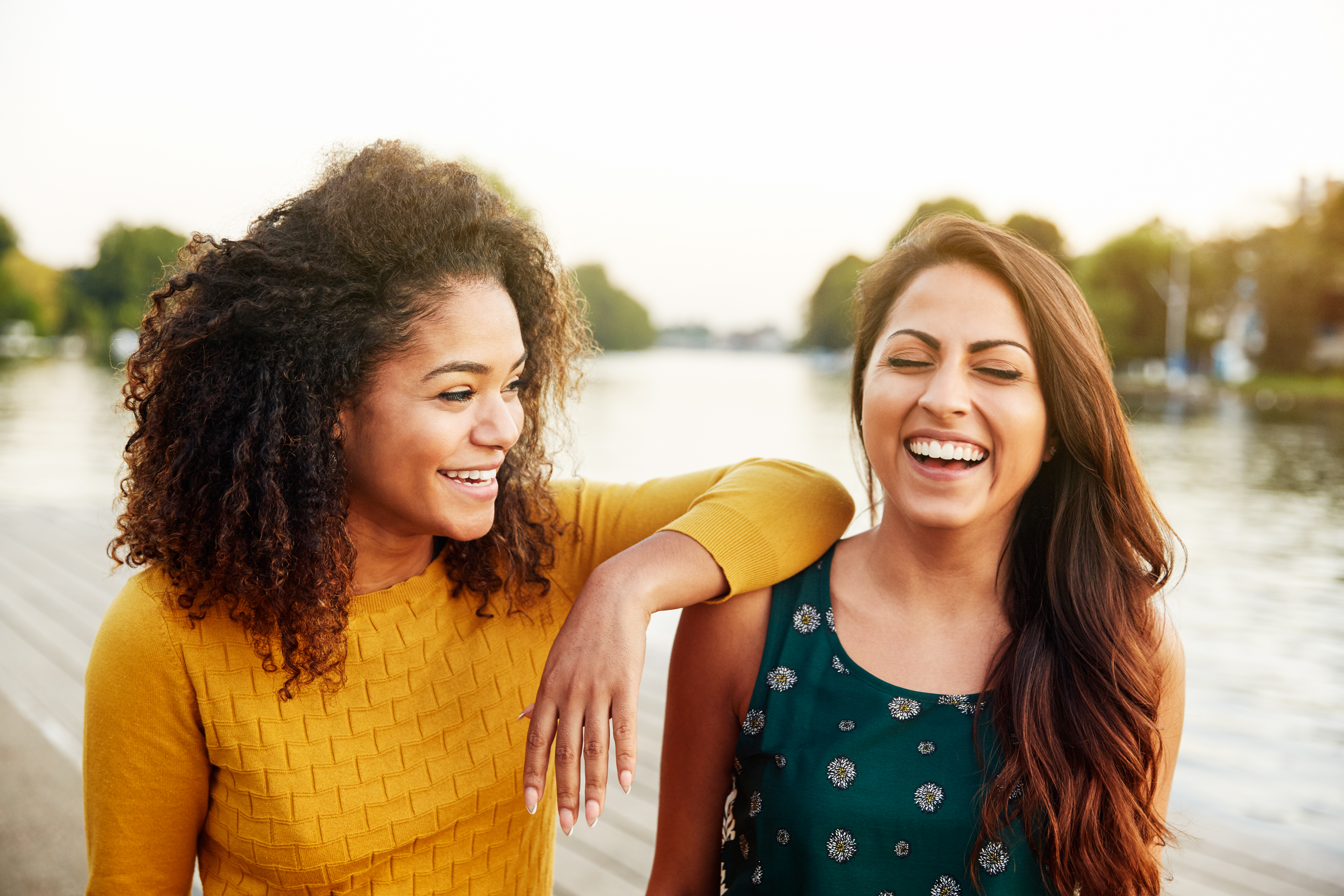 two young adult friends laughing