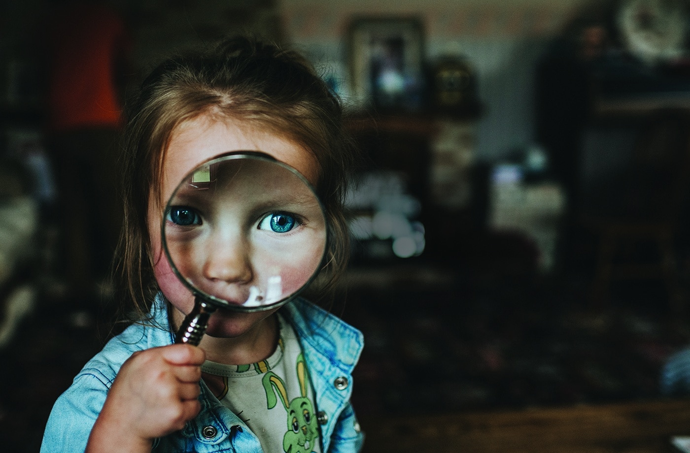 Girl with magnifying glass